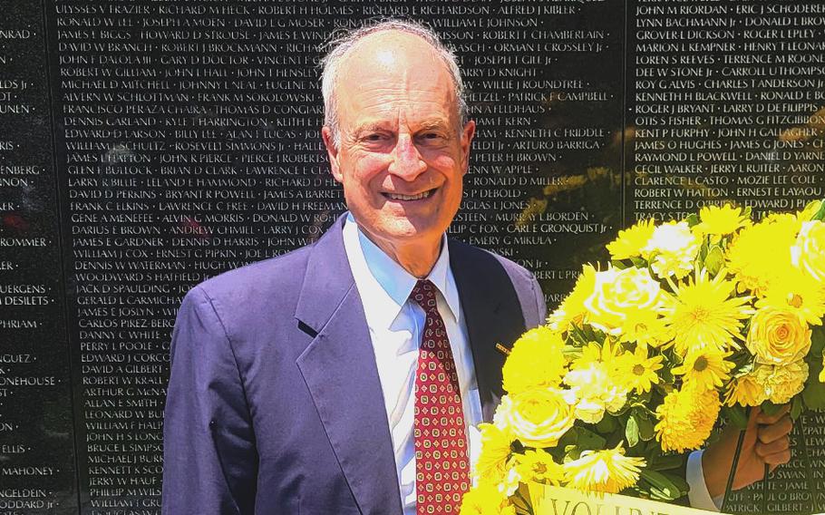Robert Doubek at the Vietnam Veterans Memorial, Washington, D.C., with a wreath placed on the 40th anniversary of the Volunteer Guides, a program Doubek founded, on May 31, 2022.