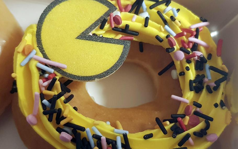 A Krispy Kreme donut featuring Pac-Man gobbling sprinkles is available for a limited time at stores across Japan.