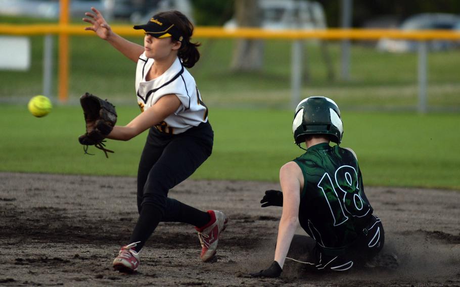 Kubasaki’s Taryn Lockhart slides safely into second base ahead of the throw to Kadena shortstop Mylein Tull during Tuesday’s DODEA-Okinawa softball game. 