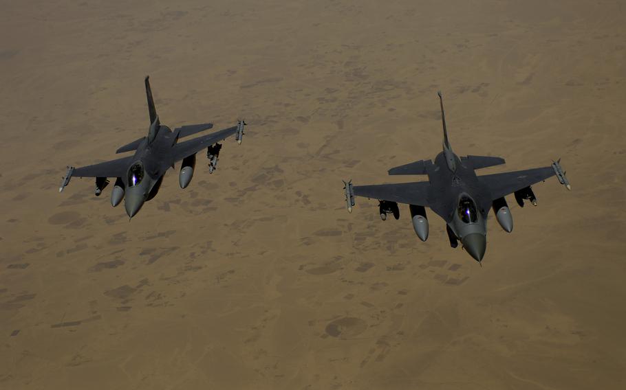 Two U.S. Air Force F-16 Fighting Falcon aircraft fly over Iraq on a mission June 10, 2008, after refueling. The U.S. relied on the 379th Air Expeditionary Wing in Al Udeid, Qatar, for air power in the Middle East and central Asia since the unit was reactivated in 2002.