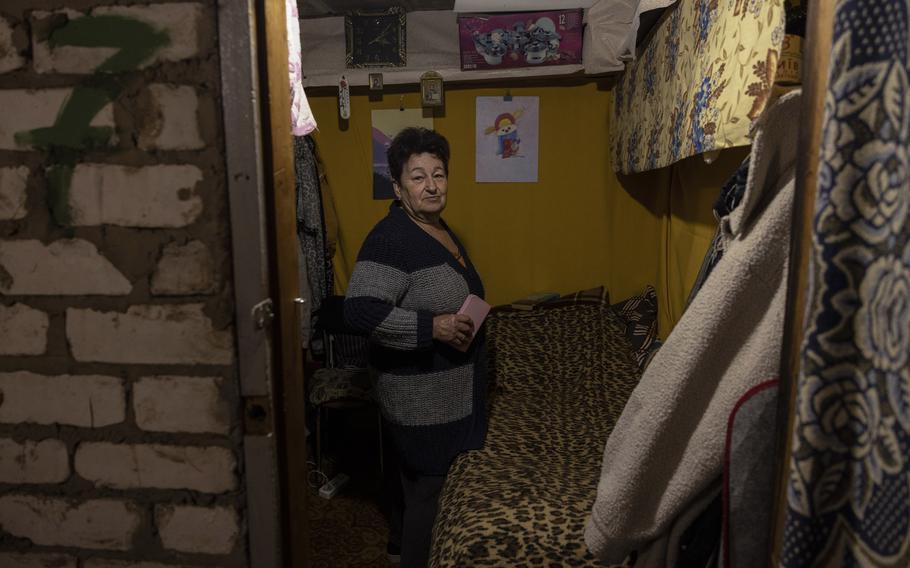 Surzhon’s makeshift bedroom is decorated with family photographs, including a picture of her late son, Pavlo.