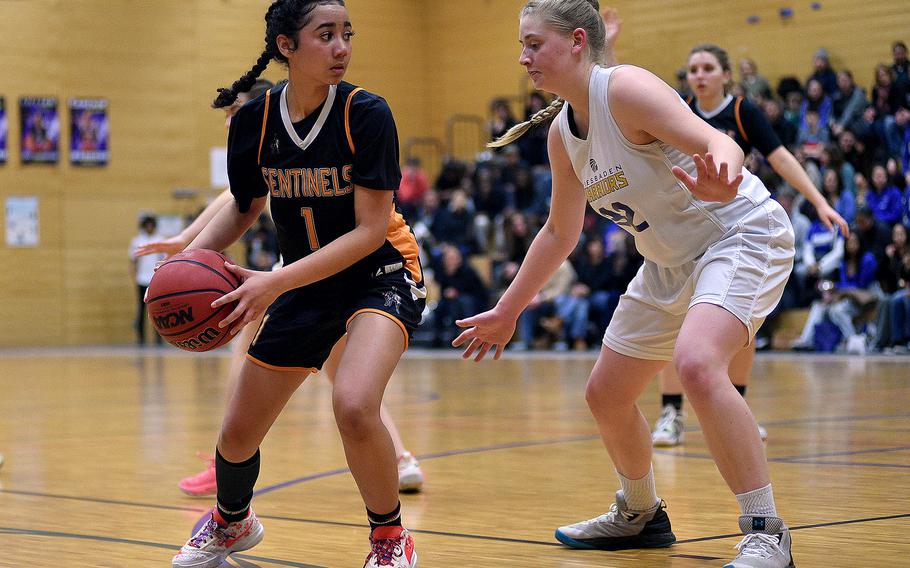 Spangdahlem's Caleya Morton looks to pass the ball while Wiesbaden's Gwen Icanberry guards during a game on Jan. 19, 2024, at Wiesbaden High School in Wiesbaden, Germany.