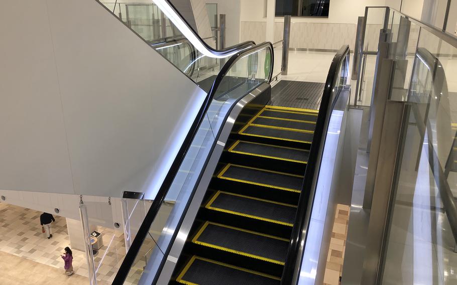 The daughter of an Okinawa-based Marine was seriously injured Saturday, Jan. 21, 2023, after falling through a gap on the righthand side of this escalator at a mall near Camp Kinser.