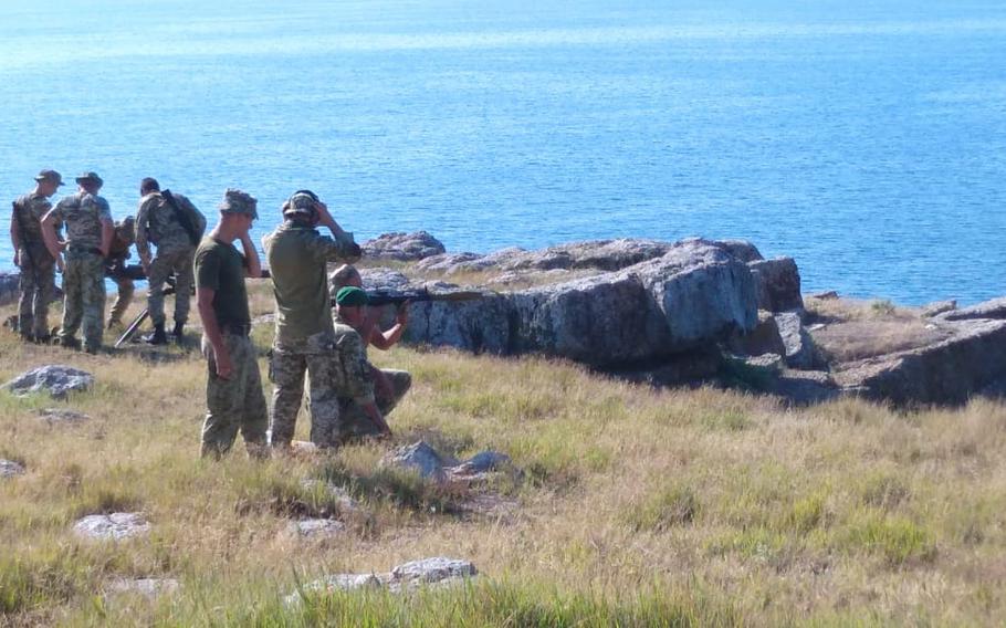 Members of Ukraine's State Border Guard Service conduct firing drills on Snake Island in August 2020. The island was attacked and taken by Russian troops on Feb. 25, 2022. The 13 personnel defending the island were killed after they refused to surrender to Russian warships, Ukraine's Foreign Affairs Ministry said.