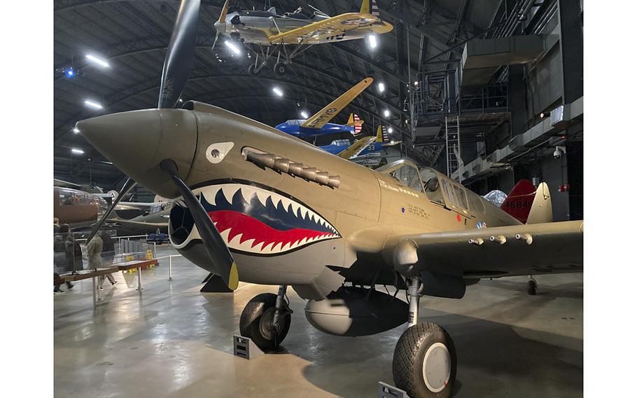 A Curtiss P-40E Kittyhawk, a World War II fighter plane, painted as a Flying Tiger at the National Museum of the U.S. Air Force.