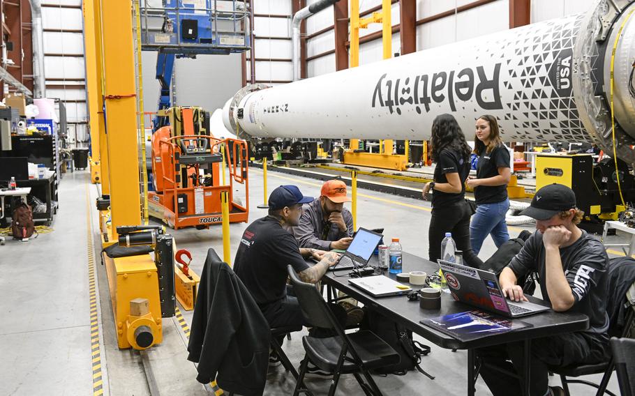 Relativity Space engineers and technicians prepare the Terran 1 rocket, the first 3D-printed rocket, in January 2023. 