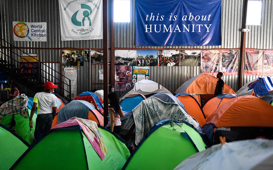 Families with children live in tents the Movimiento Juventud 2000 shelter with refugee migrants from Central and South American countries including Honduras and Haiti seeking asylum in the United States, as Title 42 and Remain In Mexico border restrictions continue, in Tijuana, Baja California state, Mexico on April 9, 2022. 