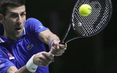 Serbia's Novak Djokovic returns the ball to Croatia's Marin Cilic during their Davis Cup tennis semifinal match at Madrid Arena in Madrid, Spain, Friday, Dec. 3, 2021.