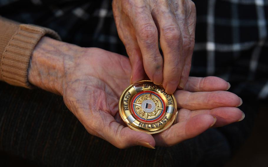 George Ellers, 101of Catonsville, Md., holds a challenge coin that was presented to him by a U.S. Coast Guard Admiral.  He served on the USS Spencer, which sank two German U-Boats during World War II. 
