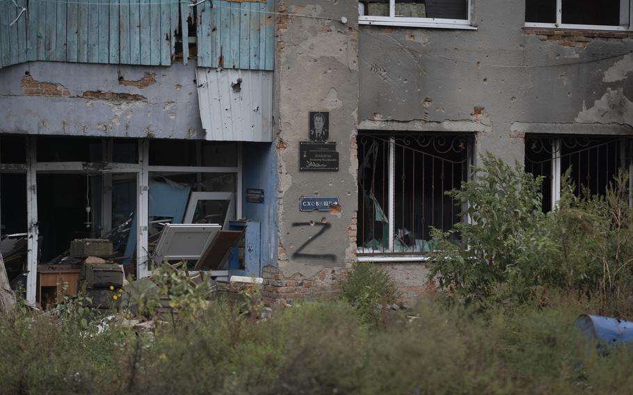 The letter Z, which has become the Russian emblem for the war, is seen on a damaged building that was occupied by Russian soldiers in the freed village of Hrakove, Ukraine, Tuesday, Sept. 13, 2022. Russian troops occupied this small village southeast of Ukraine’s second largest city of Kharkiv for six months before suddenly abandoning it around Sept. 9 as Ukrainian forces advanced in a lightning-swift counteroffensive that swept southward.