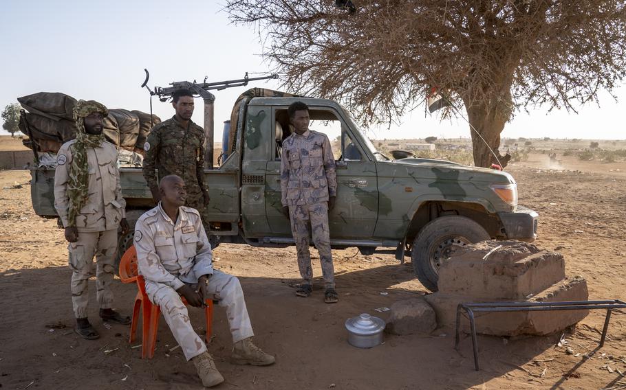 RSF soldiers watch over the border crossing post into Adre, Chad, in West Darfur, Sudan, on Feb. 20. 