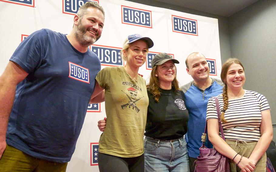 Air Force Capt. Kevin Hopper and Jamie Hopper pose with comedians Hunter Hill, far left; Iliza Shlesinger, second from left; and Laura Peek, center, at the USO on Yokota Air Base, Japan, Thursday, July 20, 2023.