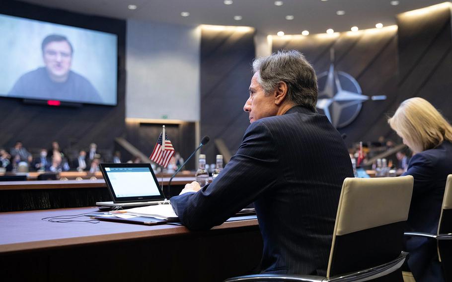 U.S. Secretary of State Antony Blinken listens to discussions during a video link with Dmytro Kuleba, the Ukrainian foreign minister, while attending a meeting at NATO headquarters in Brussels, March 4, 2022.