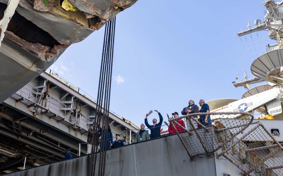 The inspection team begins its work aboard the Truman.