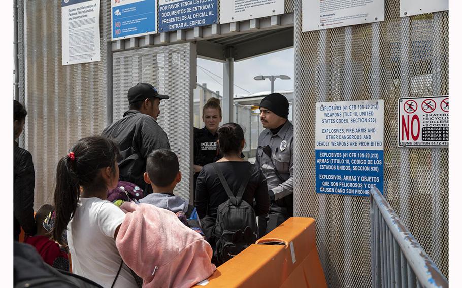 A family of ten from Michoacan, Mexico, walk to PedEast border crossing to request asylum on Thursday, May 18, 2023 in Tijuana, Baja California. 