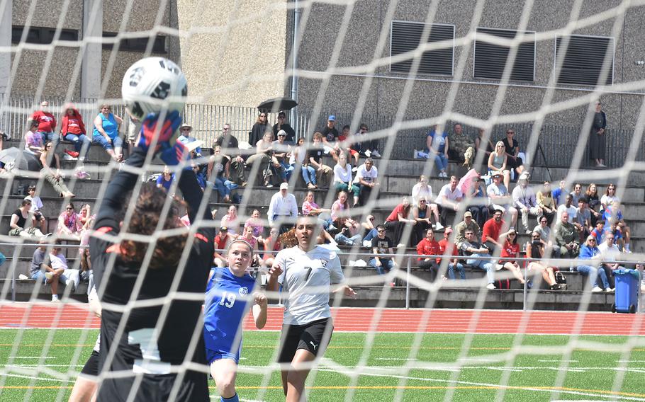 Kaiserslautern keeper Jada Hollis stops a shot from Ramstein's Kendra Brown on Monday, May 20, 2024, at the DODEA European Division I girls soccer championships at Ramstein Air Base, Germany.