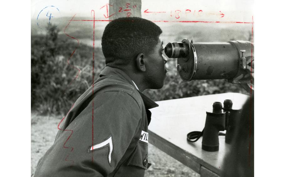 Pfc. Joseph Williams checks for communist movements across the DMZ in North Korea at Outpost Maizie. OP Maizie was manned by the 1st Reconnaissance Squadron, 9th Cavalry Regiment, 1st Cavalry Division as one of several posts strung across the 18.5 miles of DMZ border.