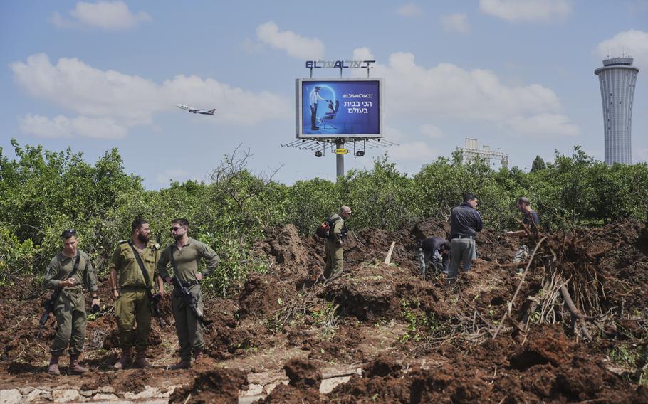 Israeli security forces inspect a ground site