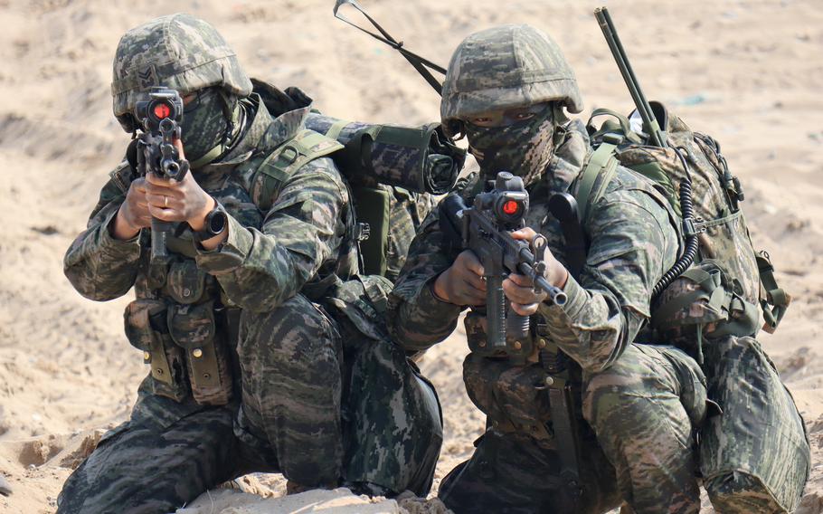 South Korean marines take  positions on the beach during the Ssangyong Exercise in Pohang, South Korea, March 29, 2023. 