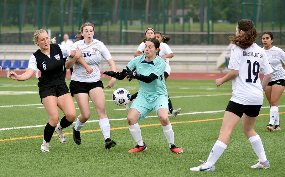 Kaiserslautern goalkeeper Rihanna Martin goes to claim a corner kick while Stuttgart striker Leeba Curlin is held by Raider defender Georgia Rawcliffe during a semifinal match at the DODEA Division I European championships May 22, 2024, at Ramstein High School on Ramstein Air Base, Germany.