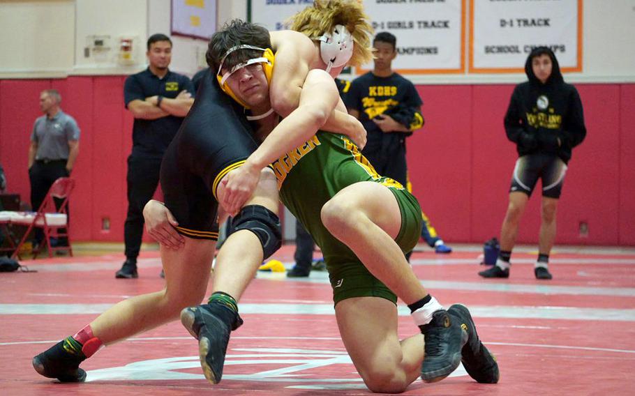 American School In Japan's Basil Reiger and Robert D. Edgren's Sebastian Sanchez seek the advantage in the 148-pound final.