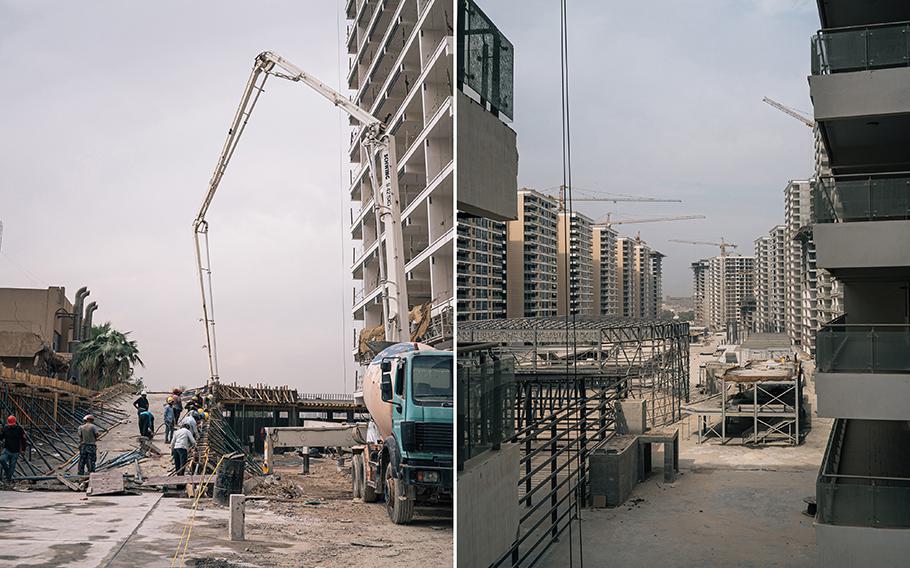 Construction workers and buildings under construction at Iraq Gate in Baghdad in September 2022. 