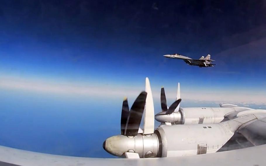 A Sukhoi-35 fighter jet is seen from a Tupolev-95 bomber in this screenshot from a video released by Russia’s Ministry of Defence, Tuesday, Oct. 17, 2023. 