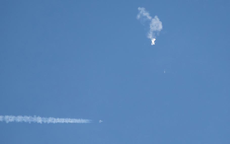 Debris falling from the sky after a Chinese spy balloon was shot down by an F22 military fighter jet over Surfside Beach, South Carolina, Saturday, Feb. 4, 2023. 
