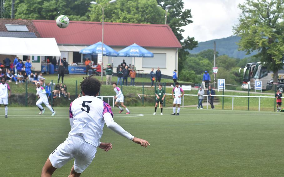 Bahrain's Mohamed Aljishsi sends a free kick towards the Naples goal Wednesday, May 22, 2024, at the DODEA European Division II boys soccer championships in Reichenbach-Steegen, Germany.