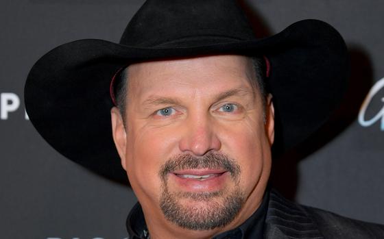 Garth Brooks attends the "Garth Brooks: The Road I'm On" Biography Celebration at The Bowery Hotel on Nov. 18, 2019 in New York City. He will co-host the 58th Academy of Country Music Awards with Dolly Parton on May 11. 