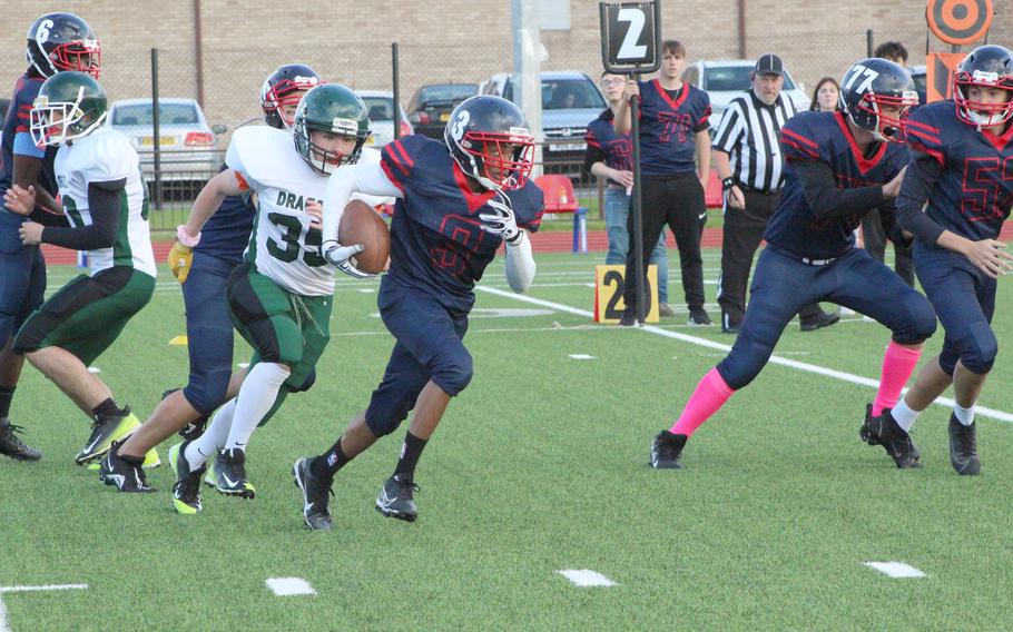 Lakenheath’s Tavaris Williams takes a hand off and cuts to the outside for a gain. But the Alconbury Dragons won the game on Friday,  Oct. 16, 2021, 32-22