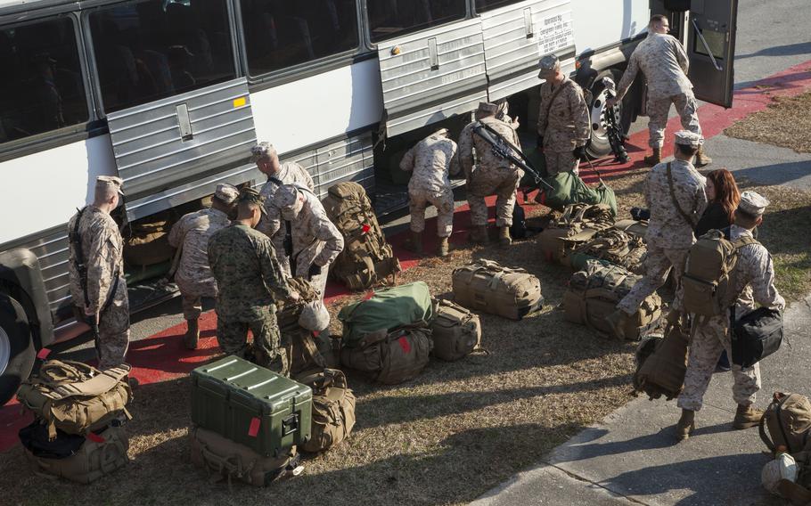 Marines with the 26th Marine Expeditionary Unit load gear onto a bus as they prepare to deploy from Camp Lejeune, N.C., in March 2013. Pentagon officials said Tuesday, Oct. 17, 2023, that the unit has been sent to the Middle East as the conflict between Israel and Hamas intensifies.