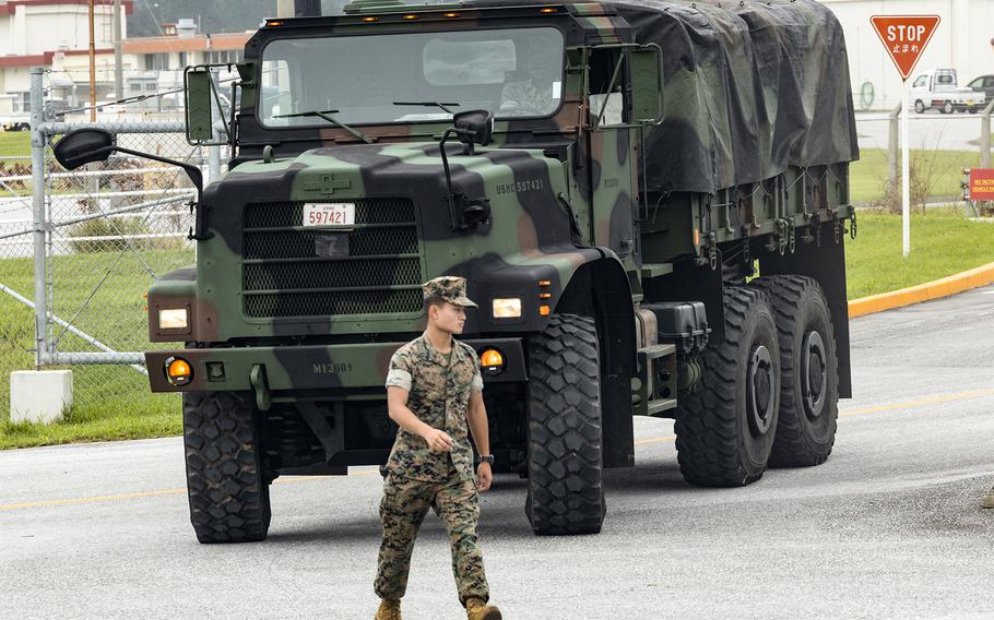 A Marine from the 3rd Marine Division ground guides a 7-ton medium tactical vehicle replacement at Camp Courtney, Okinawa, Aug. 7, 2023.