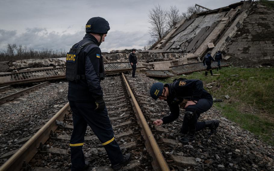 A demining team searches an area for unexploded ordnances outside Mykolaiv. 