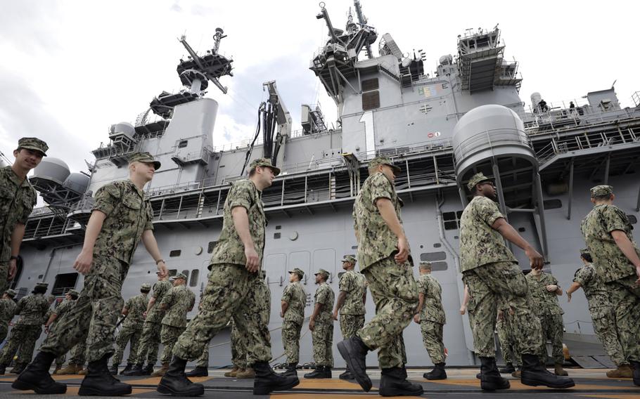 U.S. military personnel gather to board the USS Wasp aircraft carrier ahead of the Memorial Day address by President Trump at the U.S. naval base in Yokosuka, Kanagawa Prefecture, Japan, on May 28, 2019. 