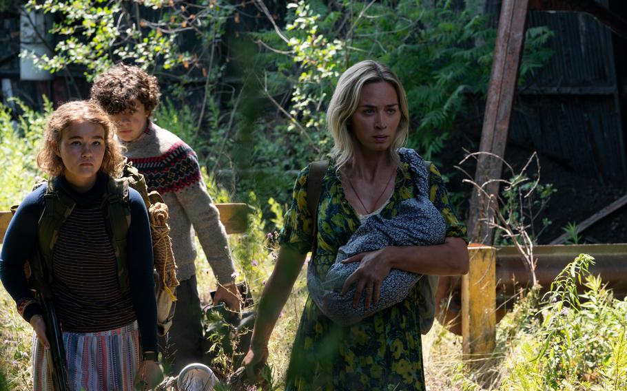 L-r, Regan (Millicent Simmonds), Marcus (Noah Jupe) and Evelyn (Emily Blunt) brave the unknown in "A Quiet Place Part II.”