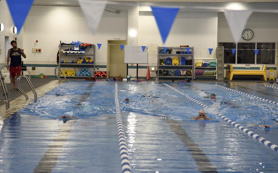 Swimming coach Sho Shimazaki observes swimmers during the master’s advanced course at Yokota Air Base, Japan, Friday, May 27, 2022.