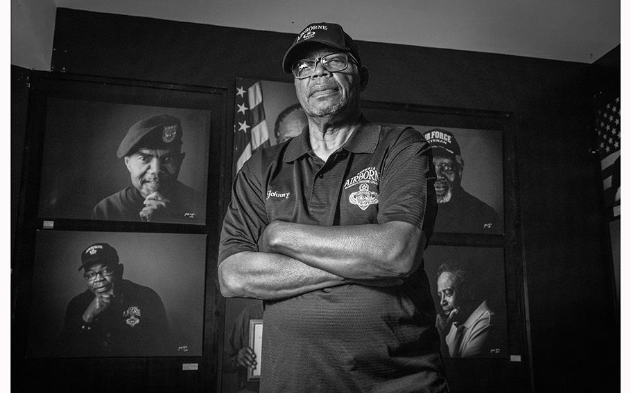 Vietnam Veteran Sgt. Johnny Miller stands in front of a series of portraits of Black Vietnam War veterans now on display at the Marietta History Center Tuesday, June 27, 2023. 