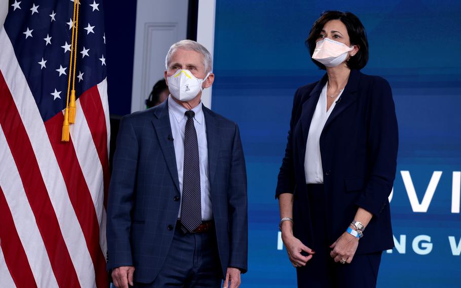 From left, Dr. Anthony Fauci, director of the National Institute of Allergy and Infectious Diseases and the Chief Medical Advisor to the President, and Centers for Disease Control and Prevention Director Rochelle Walensky, arrive for a video call with U.S. President Joe Biden, the White House COVID-19 Response Team and the National Governors Association in the South Court Auditorium at the Eisenhower Executive Office Building on Dec. 27, 2021, in Washington, D.C. 