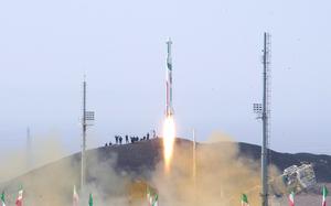 A picture of a rocket blasting off; some Iranian flags are visible at the bottom of the image.