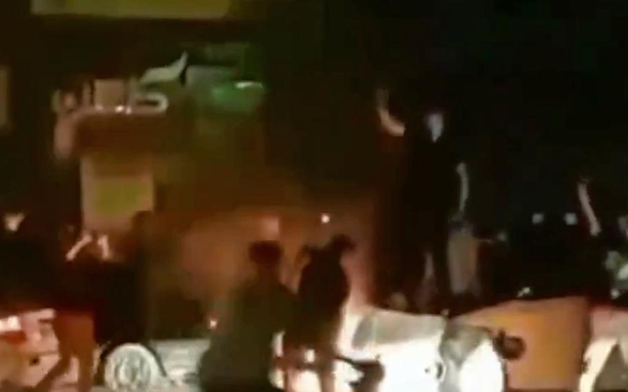 A screenshot of a video posted to Twitter purportedly shows people protesting in Iran. The death of a 22-year-old woman in police custody has sparked widespread demonstrations in the country, which is experiencing domestic turmoil as it seeks to negotiate a new deal with the U.S. regarding its nuclear program.