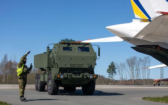 An Estonian ground guide directs an M142 High Mobility Artillery Rocket System, or HIMARS, off the airfield at Amari Air Base, Estonia, April 29, 2025. The U.S.-made weapons systems were handed over to the Baltic country at a ceremony at the base the next day.