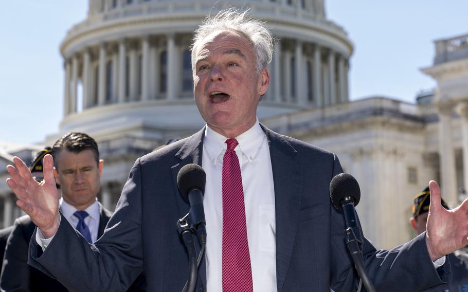 Sen. Tim Kaine, D-Va., center, and Sen. Todd Young, R-Ind., center left, are joined by representatives of the American Legion as they speak to reporters about ending the authorization for use of military force enacted after the Sept. 11, 2001, terrorist attacks, at the Capitol in Washington, Thursday, March 16, 2023. Senators voted 68-27 Thursday to move forward with a bill to repeal the 2002 measure that authorized the March 2003 invasion of Iraq and a 1991 measure that sanctioned the U.S.-led Gulf War to expel Iraqi leader Saddam Hussein's forces from Kuwait.