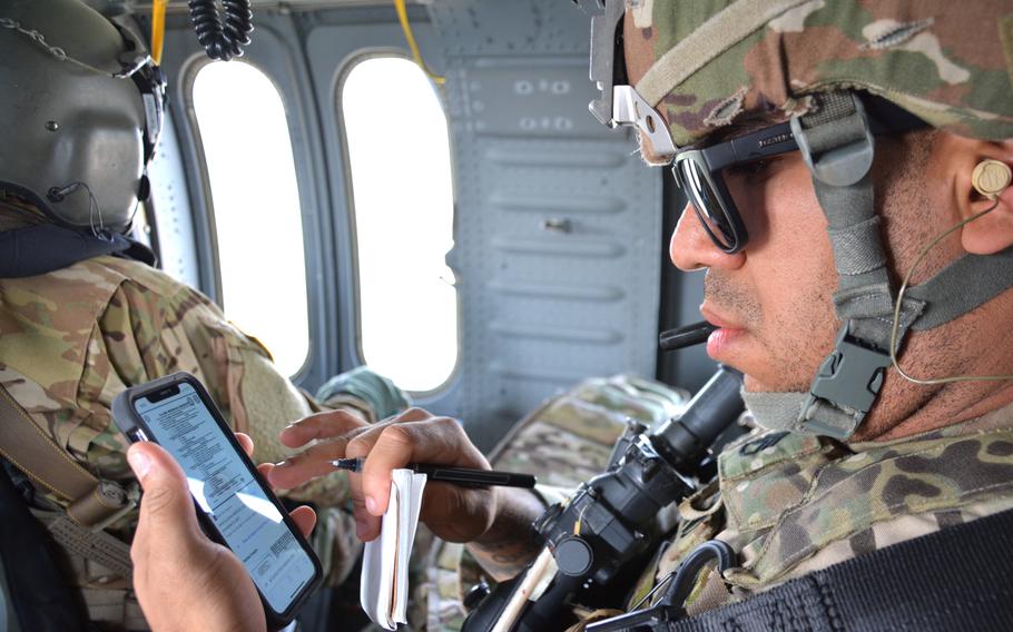 Army Staff Sgt. Stiven Cedeno, an attack helicopter repairer with the 602nd Aviation Support Battalion, 2nd Combat Aviation Brigade, studies his notes during a flight from Camp Casey to Camp Humphreys, South Korea, Wednesday, May 4, 2022. 