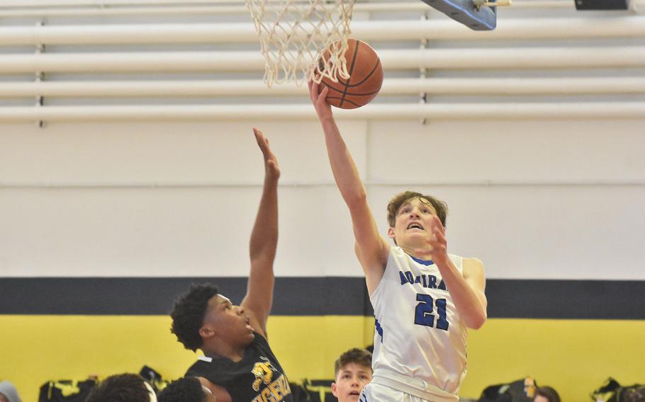 Rota's Edward DeMeritt drives to the basket on Friday, March 4, 2022, at the DODEA-Europe Division II basketball championships.