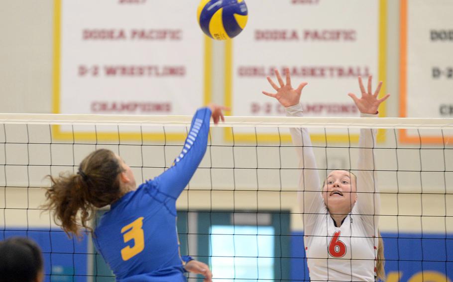 Yokota's Lilly Wellons spikes against E.J. King's Madylyn O'Neill during Saturday's DODEA-Japan volleyball match. The Cobras won in three sets, sweeping the two weekend matches against the Panthers.