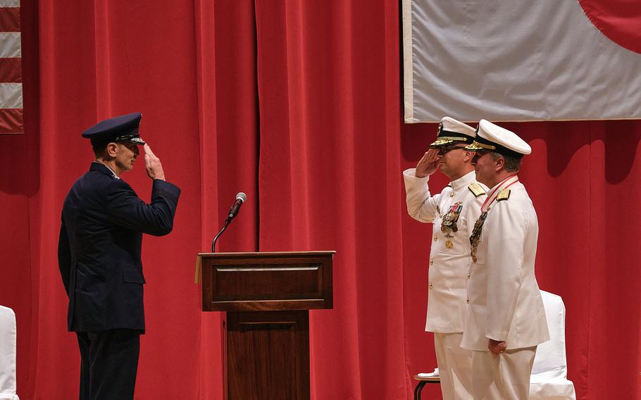 The commander of U.S. Forces Japan, Air Force Lt. Gen. Kevin Schneider, left, presides over a change-of-command ceremony for U.S. Naval Forces Japan and Navy Region Japan at Yokosuka Naval Base, Japan, Wednesday, July 14, 2021. 