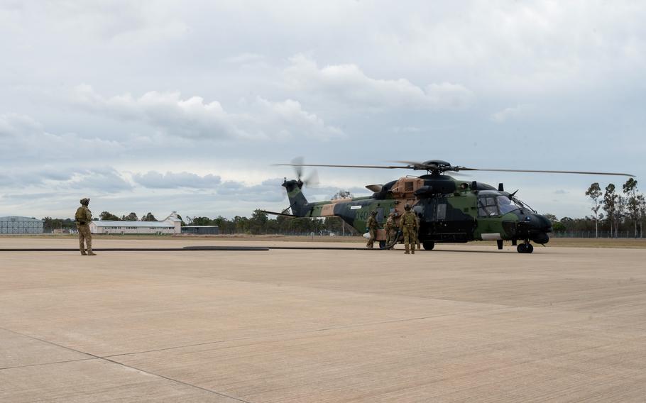 U.S. and Australian airmen refuel an MRH-90 Taipan during a Talsman Sabre drill at Royal Australian Air Force Base Amberley, Australia, July 24, 2023. 