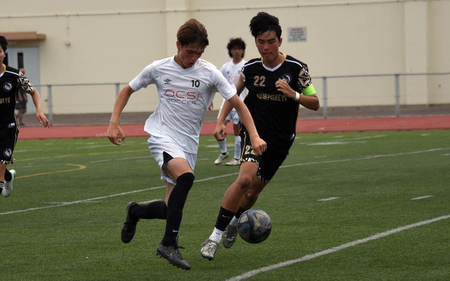 OCSI's Stani Marynowski and Humphreys' Sean Kang chase the ball.