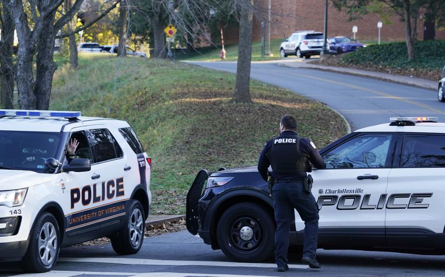 Charlottesville police secure a crime scene of an overnight shooting at the University of Virginia, Monday, Nov. 14, 2022, in Charlottesville, Va.